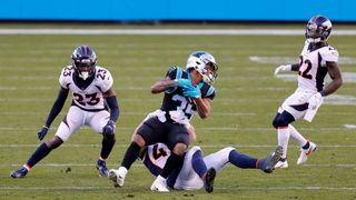 Rodney Smith #35 of the Carolina Panthers is tackled by Josey Jewell #47 of the Denver Broncos during the third quarter of their game at Bank of America Stadium on Dec. 13, 2020 in Charlotte, North Carolina.