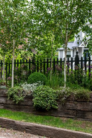 railing fence with raised beds in front