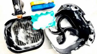soapy air fryer and air fryer components and a sponge