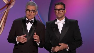 From left to right Eugene Levy and Dan Levy hosting the Emmys in 2024.