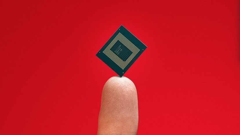 Cropped image of a Snapdragon chip on a finger