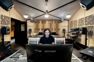 A sound engineer mixing Dolby sounds with Genelec solutions. 