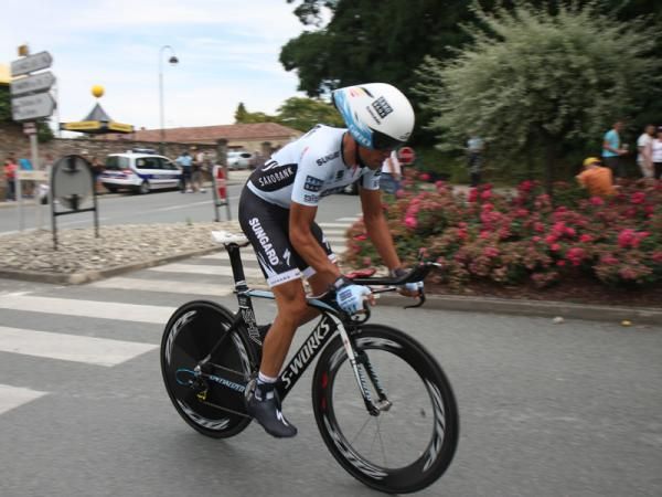 Alberto Contador (Saxo Bank Sungard) heads for the safety of the team bus after Sunday's team time trial.