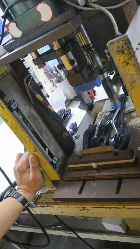 The rails are fitted into the base using a hydraulic press