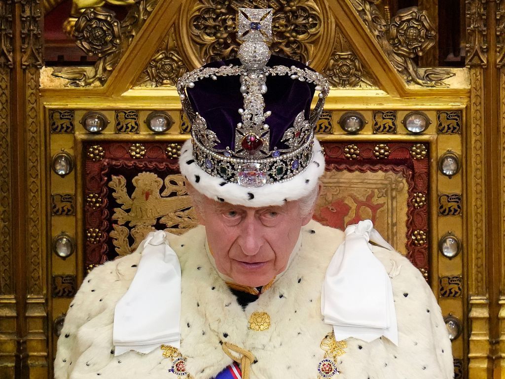 Britain&#039;s King Charles III, wearing the Imperial State Crown and the Robe of State, reads the King&#039;s speech from The Sovereign&#039;s Throne in the House of Lords chamber, during the State Opening of Parliament, at the Houses of Parliament, in London, on November 7, 2023