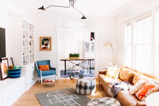 storage built-in bespoke cabinets by JL Design in a living room