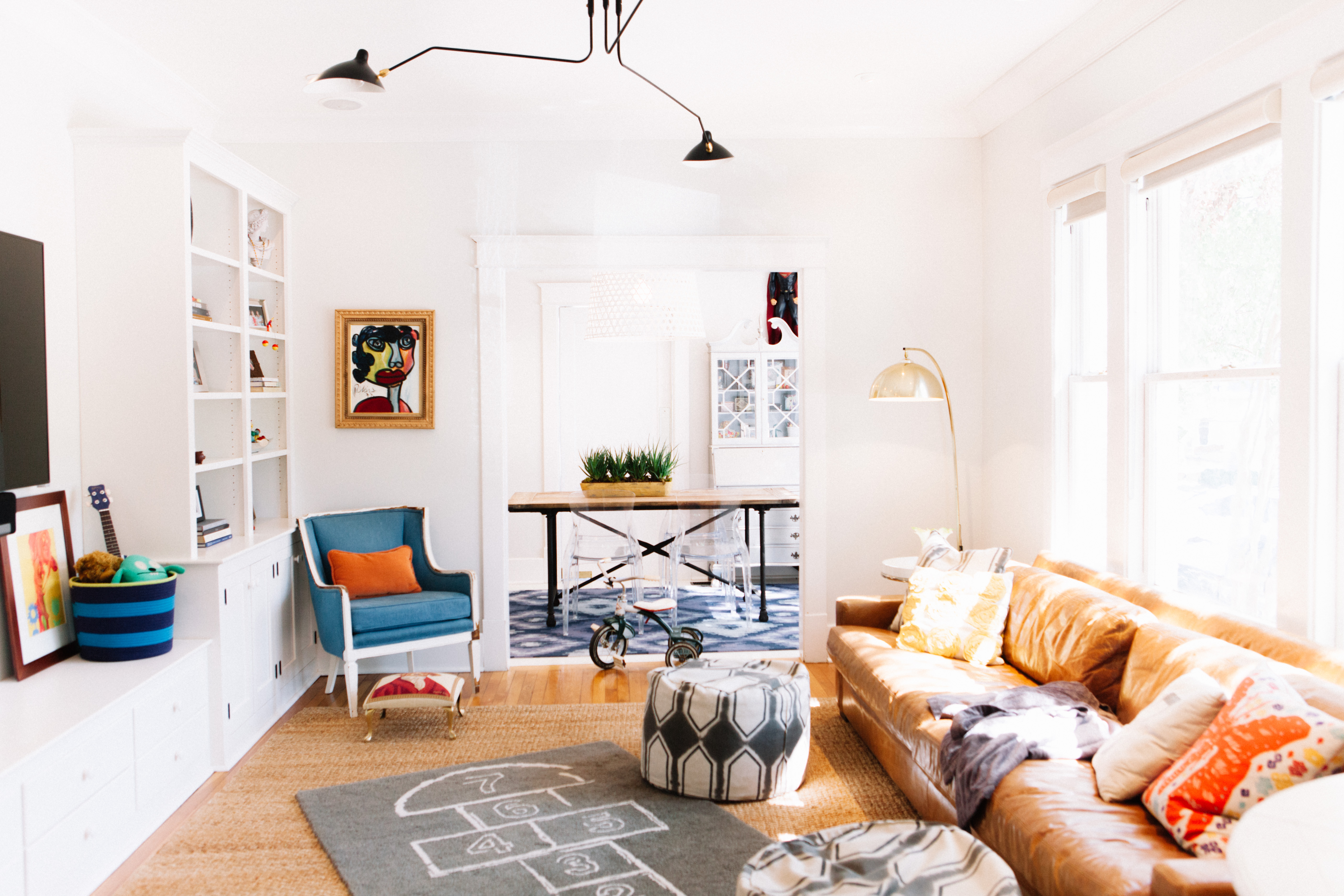 storage built-in bespoke cabinets by JL Design in a living room