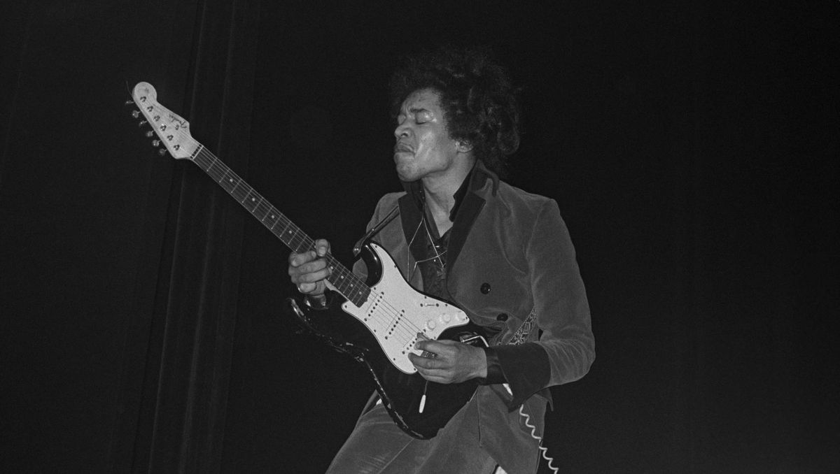 Jimi Hendrix performs onstage in 1967