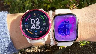 the Garmin Forerunner 570 and Apple Watch 11 on the wrist