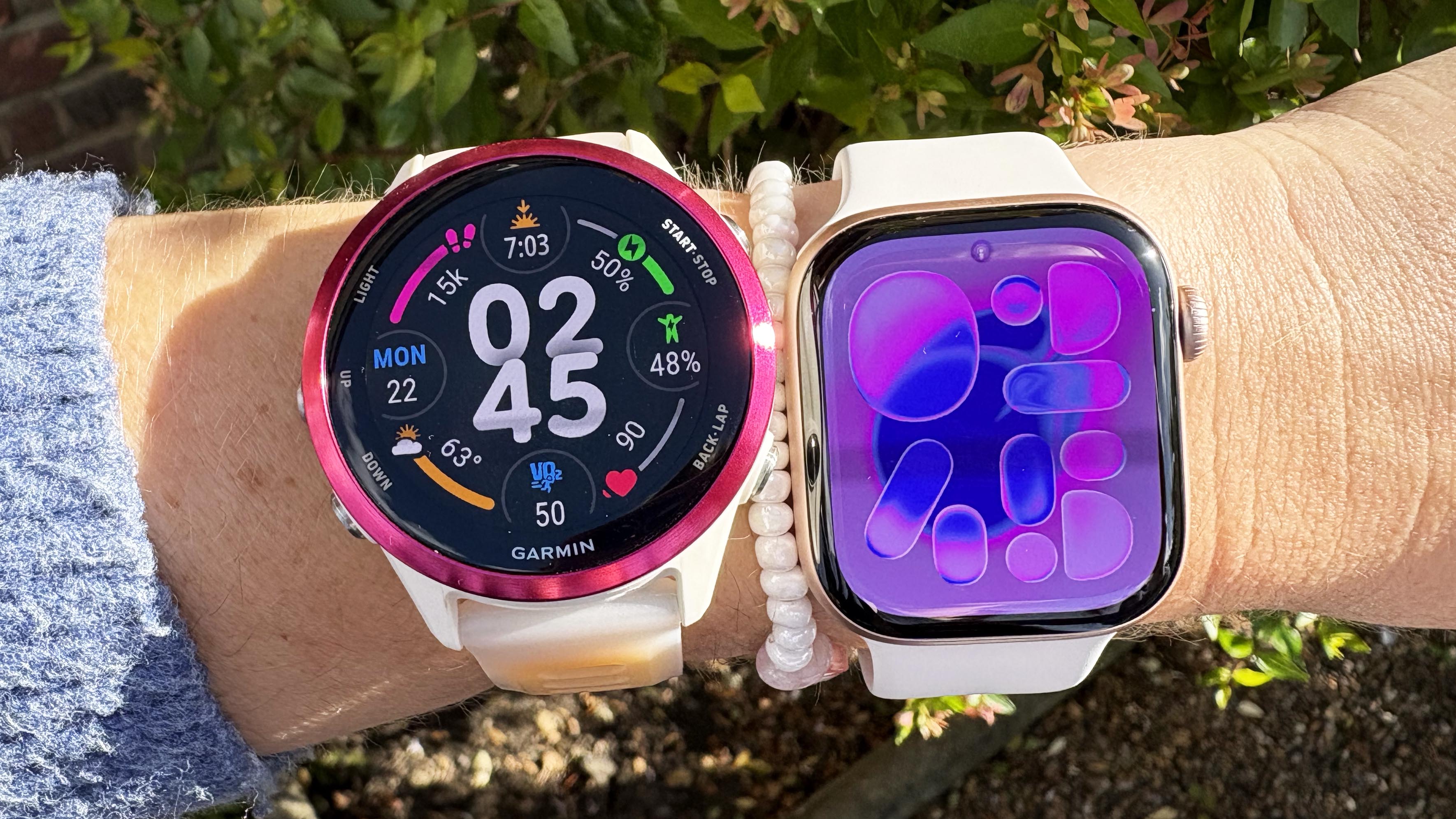 the Garmin Forerunner 570 and Apple Watch 11 on the wrist