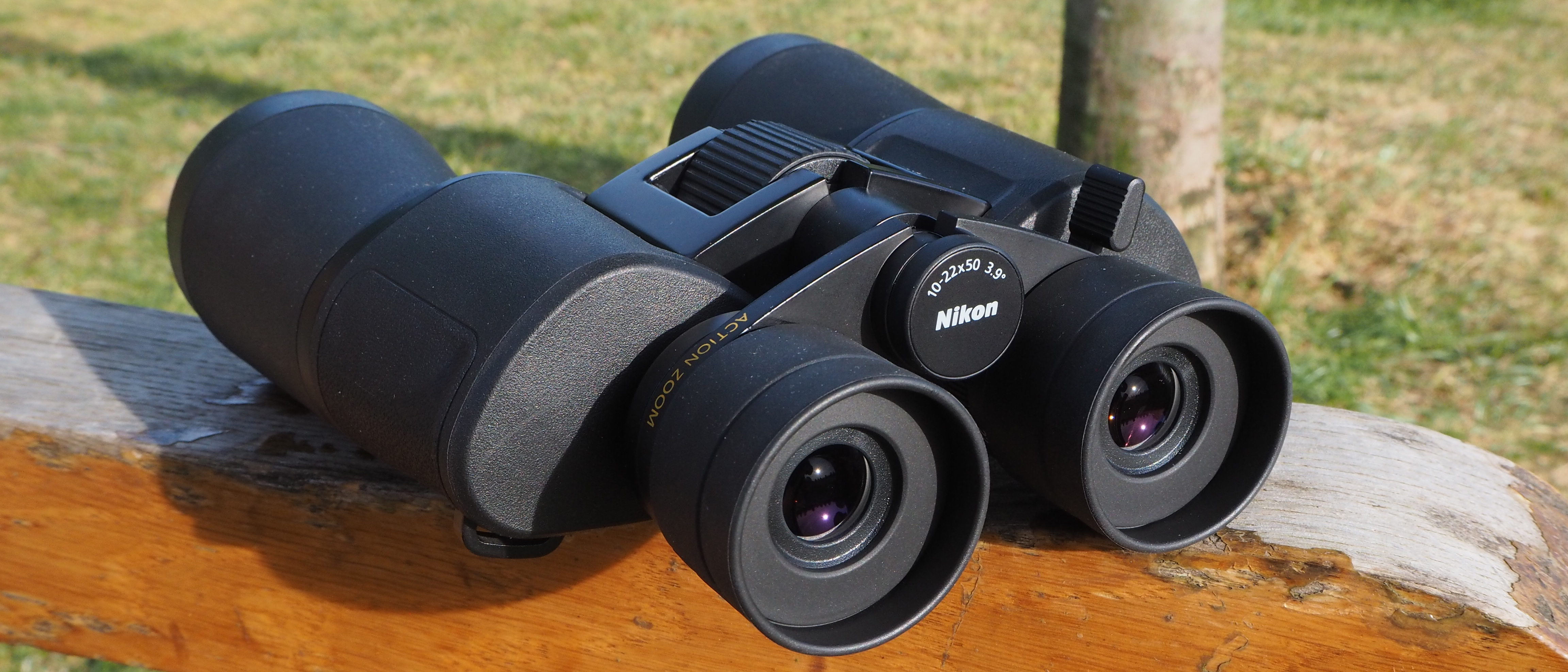 Nikon Action Zoom 10-22x50 binoculars on a post