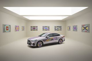 BMW i5 Flow NOSTOKANA in gallery space surrounded by art