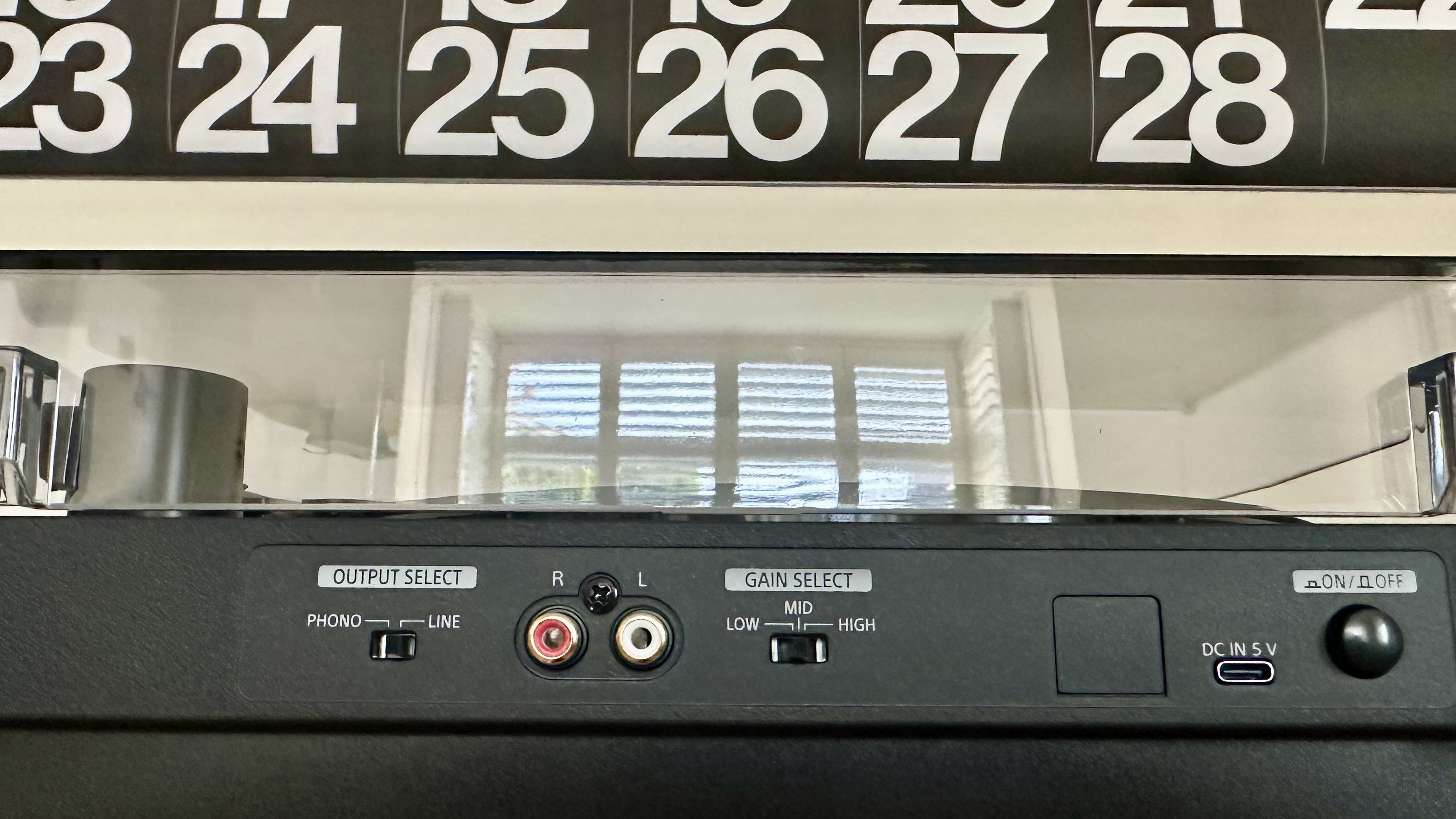 Sony PS-LX510BT turntable on a brown wood hi-fi rack, with closeups