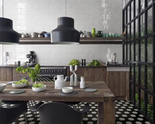 black and white monochrome Victorian Unglazed Hexagon Tiles in a industrial style kitchen with stripped wood cabinetry and black metal frame windows and mid century modern lighting