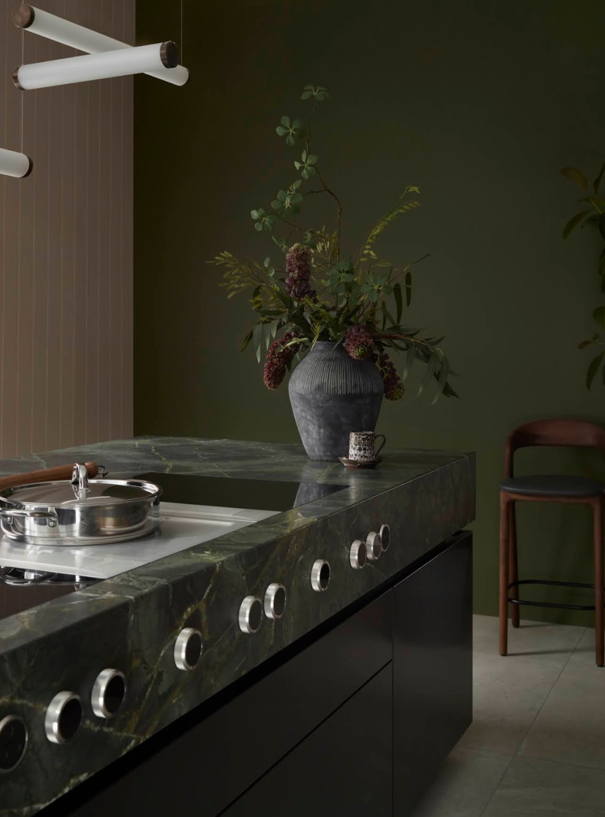 green kitchen with green marble kitchen island