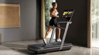 Woman running on Technogym MyRun treadmill