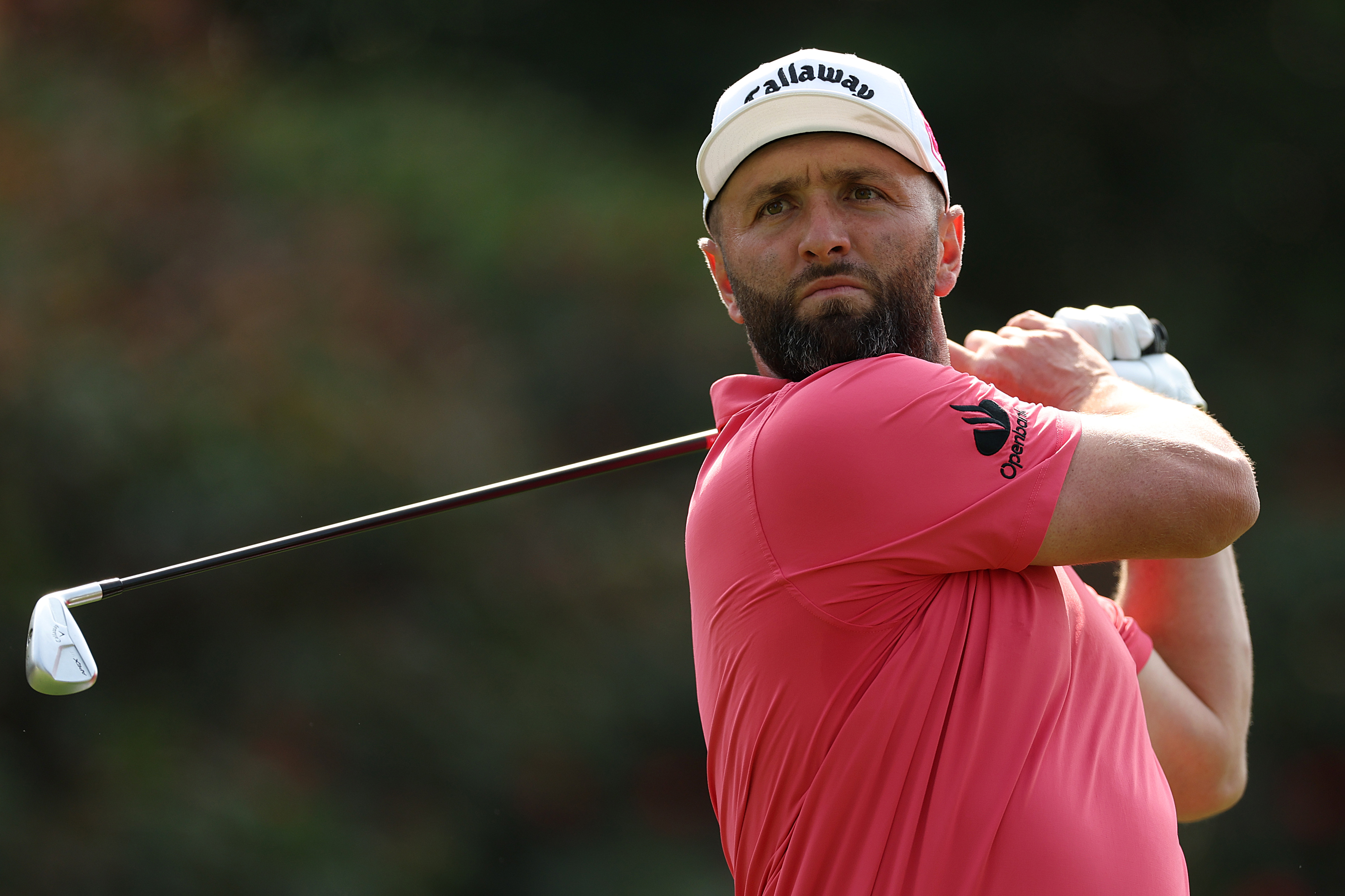 Jon Rahm hits a utility iron off the tee