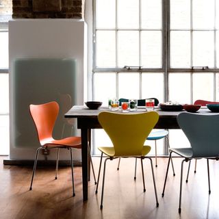 dining table with colourful chairs