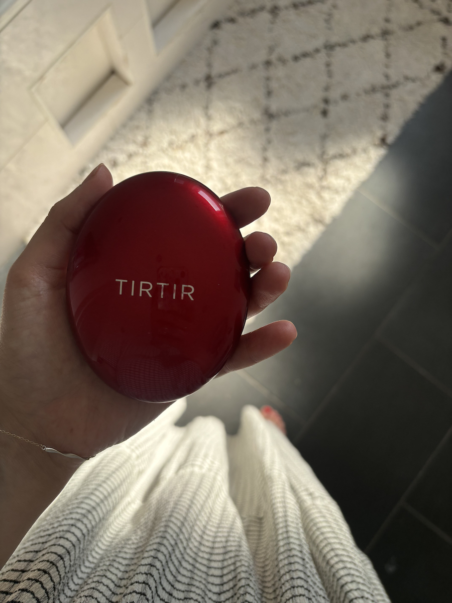 Mica Ricketts holding TirTir Mask Fit Red Cushion Foundation
