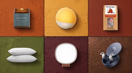 A collage of cozy sleep products against autumnal-colored tiles, including moss green, mustard, burgundy and brown