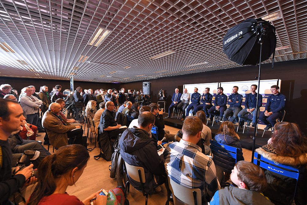 Riders take the stage for the team press conference at the Quick-Step Floors Pop-Up Store in the Ring Shopping Center in Kortrijk