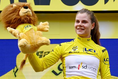 Lotte Kopecky poses with a toy lion at the Tour de France Femmes 2023