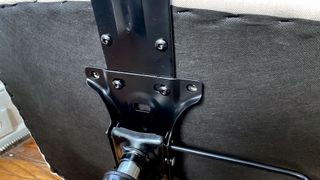 Fastening hardware on the underside of an office chair