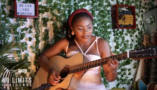Helen Ibe plays an offset Martin SC acoustic guitar