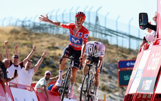Enric Mas of Spain and Movistar Team - Red Leader Jersey celebrates at finish line as stage winner ahead of Oscar Onley of Great Britain and Netcompany INEOS Cycling Team 