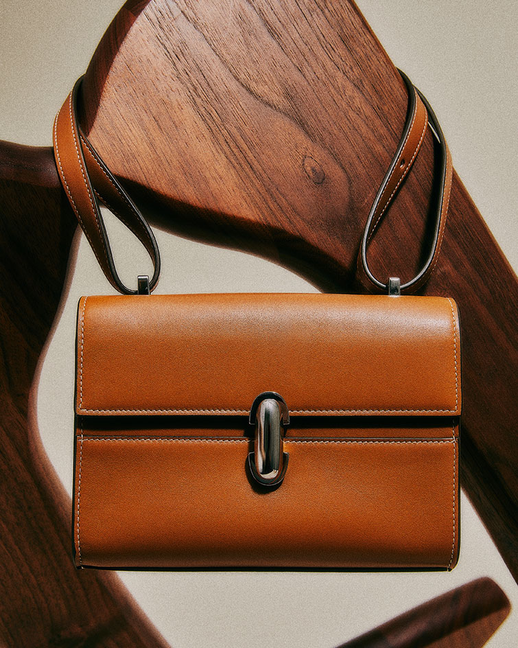 Symmetry Pochette leather handbag by Savette