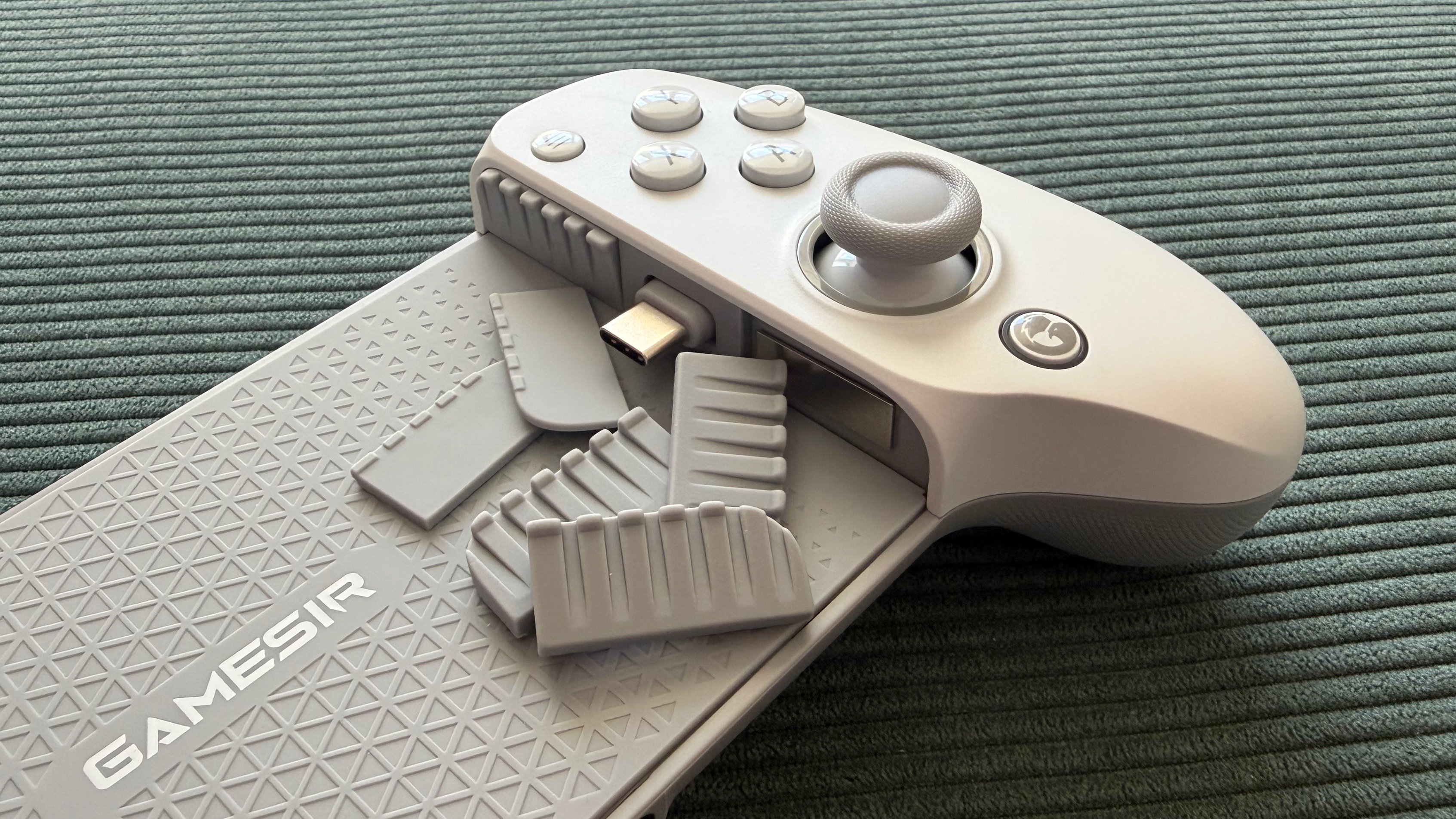 The GameSir G8+ MFi mobile controller on a green surface