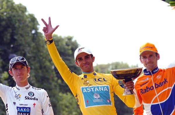 Three fingers aloft for three Tour victories by Alberto Contador.