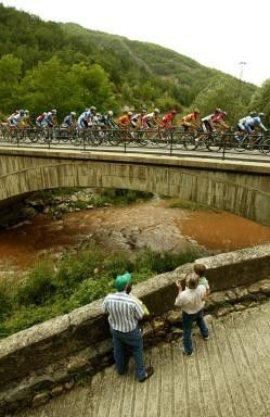 The peloton passes over a bridge during stage 11