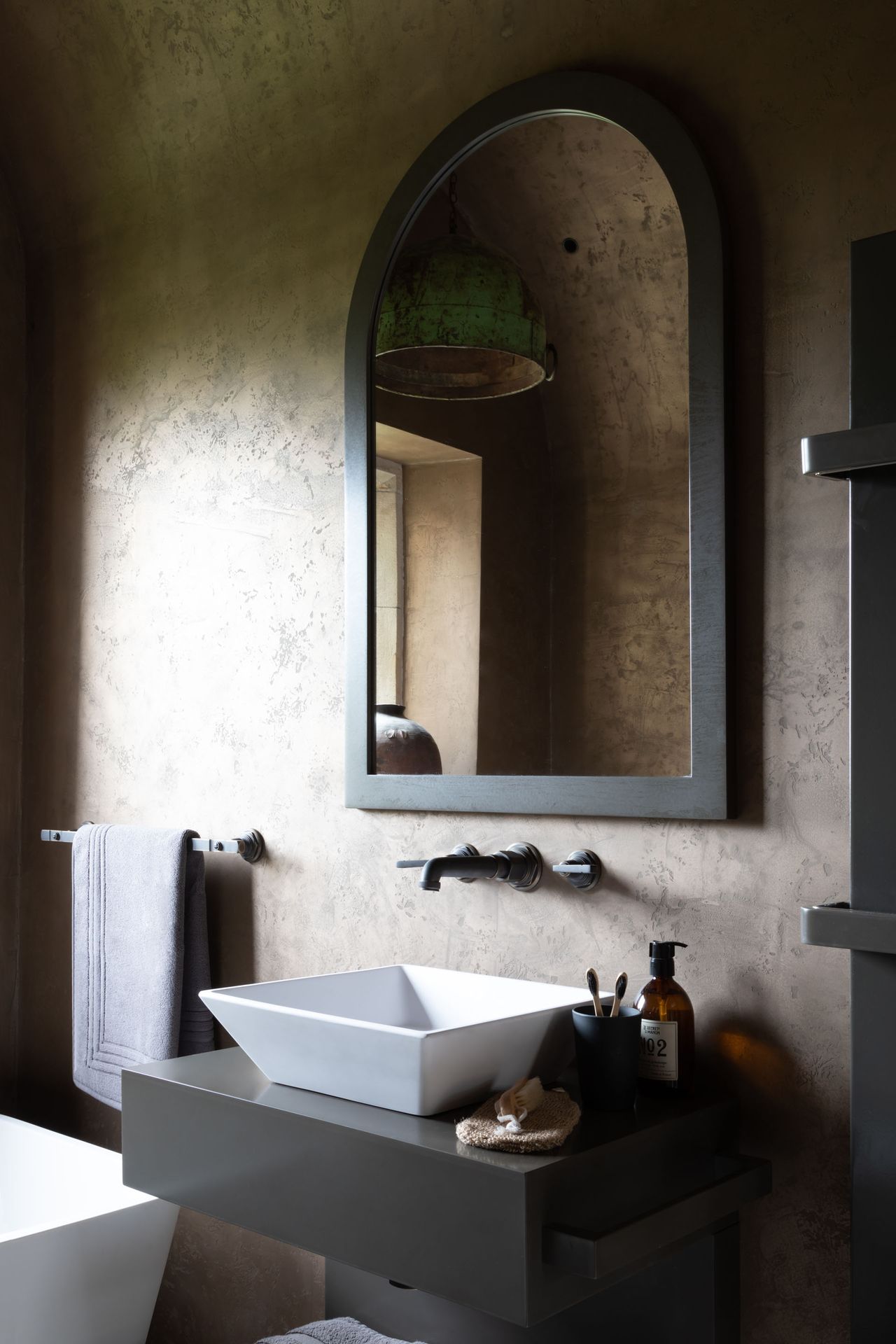 Sink and black framed mirror