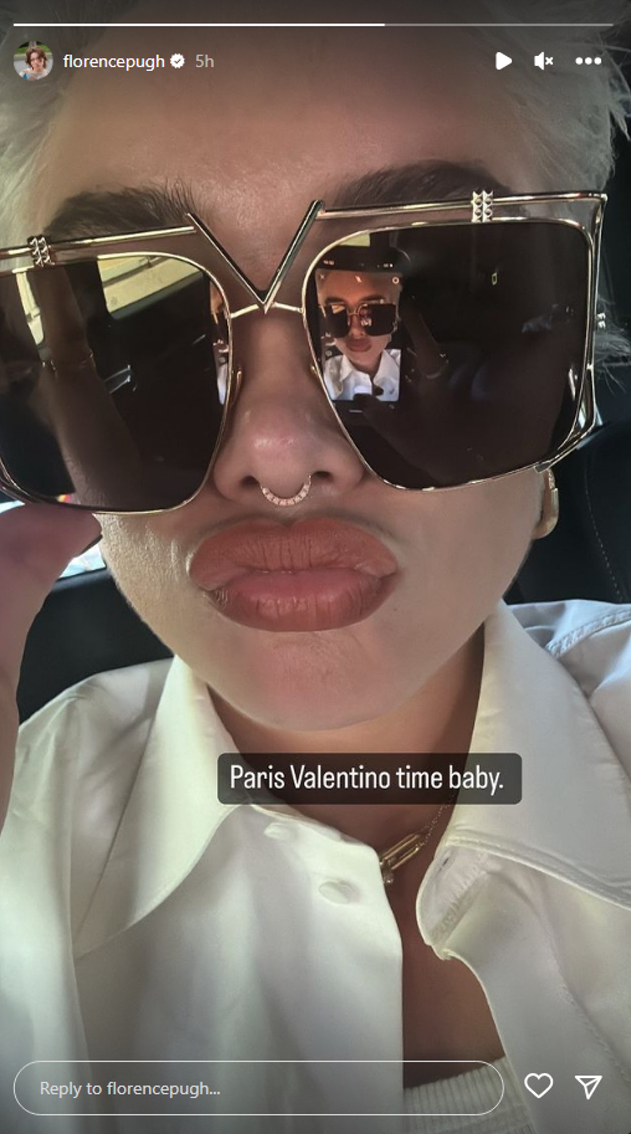 Florence Pugh took a selfie of her wearing a big pair of sunglasses.