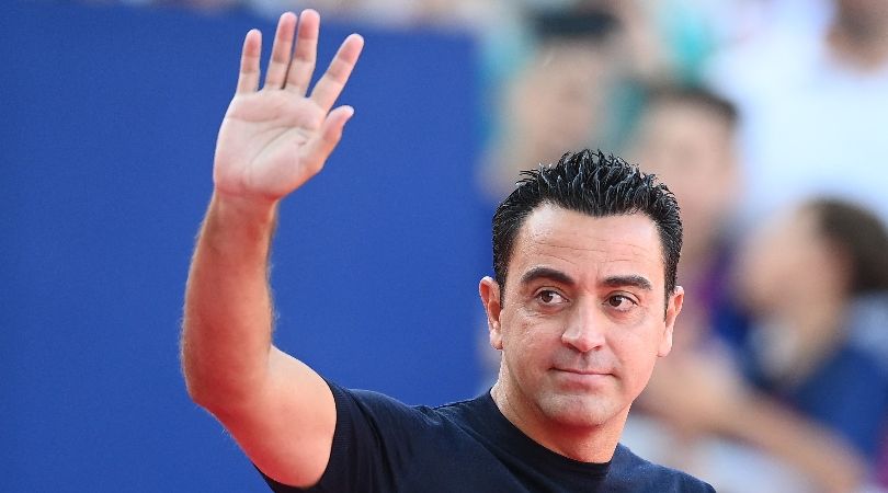 Barcelona coach Xavi waves to fans during the Gamper Trophy game against Tottenham in August 2023.