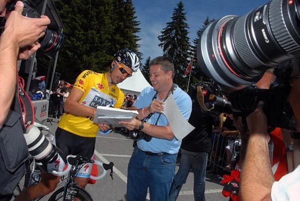 Race leader Fabian Cancellara is kept busy before stage two begins.