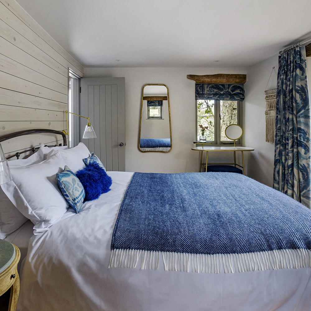 bedroom with white wall and white bed