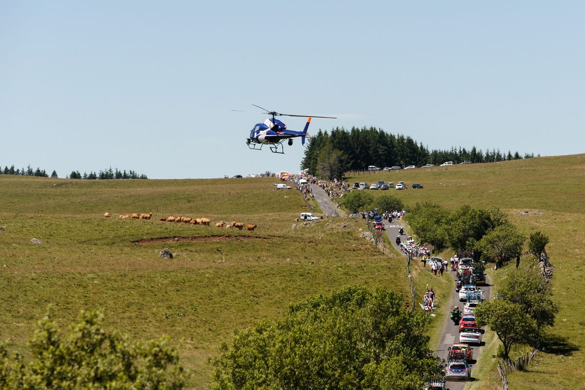 The peloton on the rolling roads through the Massif Central during stage 15