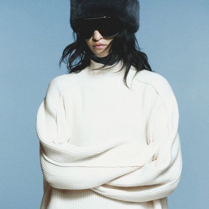 collage of models wearing zara and H&M sweaters on light grey background