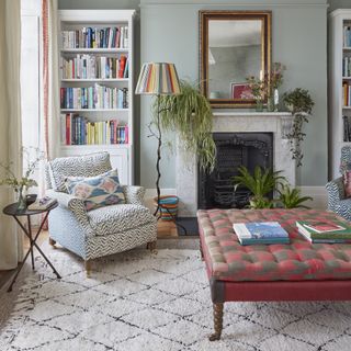 Living room with pattern clashing on armchair and footstool