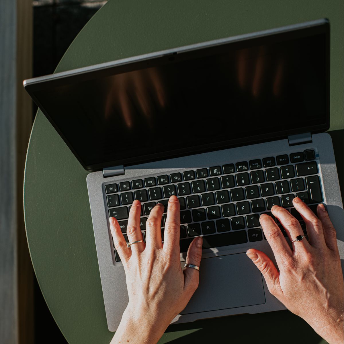 woman typing on a laptop