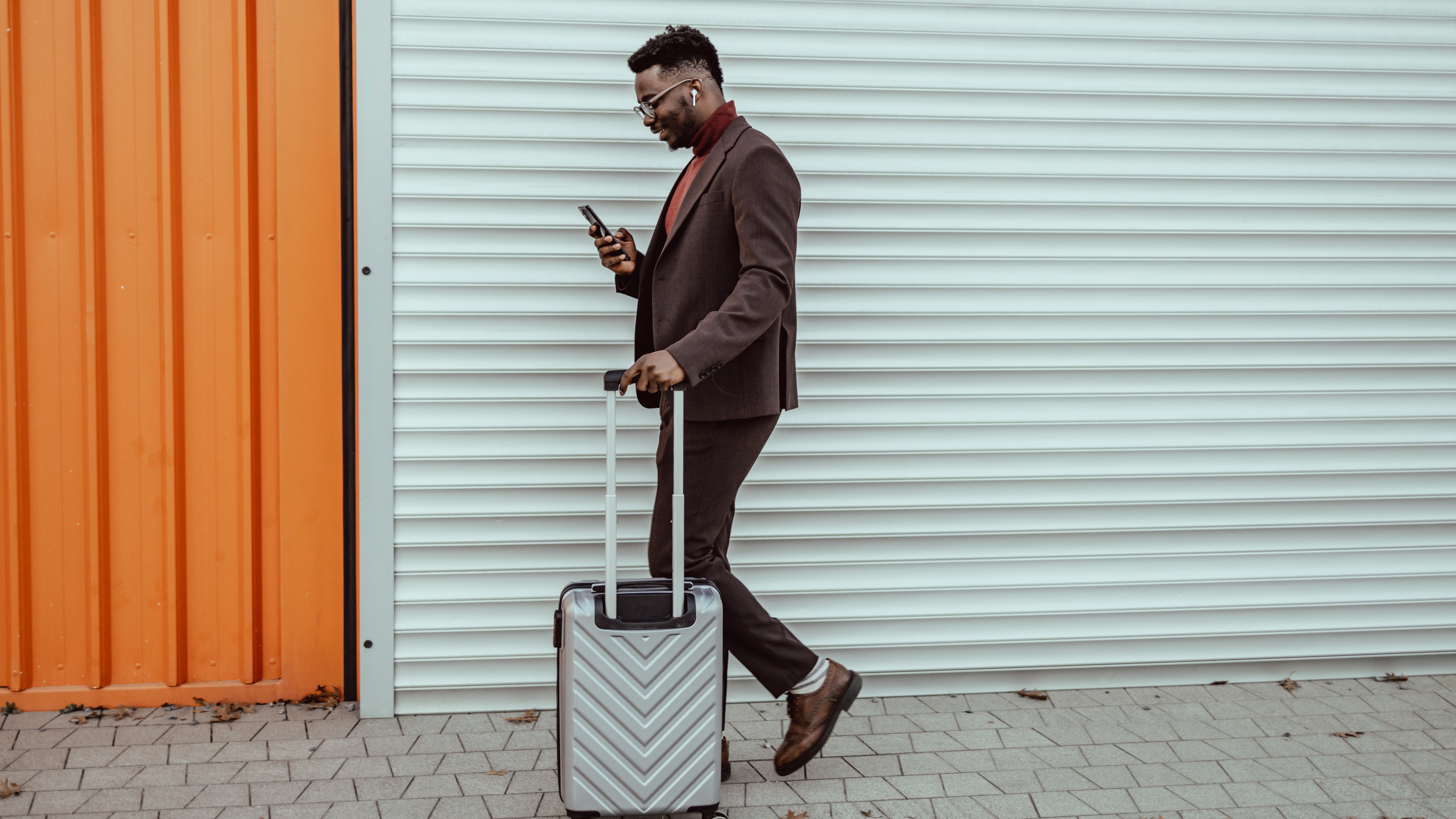 Man walking with smart luggage while traveling