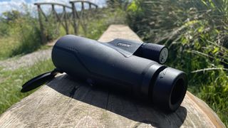 Python Rangemaster monocular on a wooden bench