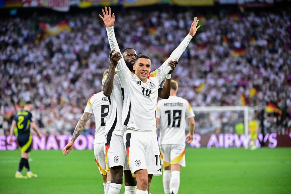 Germany&#039;s midfielder #10 Jamal Musiala celebrates with teammates after scoring his team&#039;s second goal during the UEFA Euro 2024 Group A football match between Germany and Scotland at the Munich Football Arena in Munich on June 14, 2024.