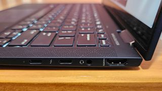 A macro shot of the ports on the side of the HP Elitebook Dragonfly. It has two micro USB ports, a 3.5mm headphone jack, and an HDMI port.