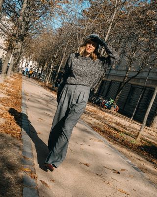 woman in gray pants and sweater