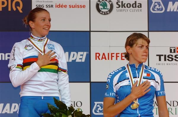 Italians Tatiana Guderzo and Noemi Cantele listen as their national anthem rings out around Mendrisio.
