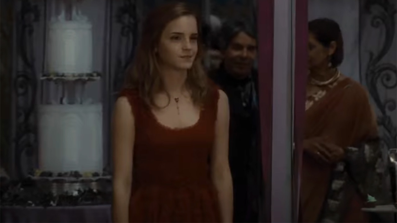 Emma Watson as Hermione in her red dress at Bill and Fleur's wedding.