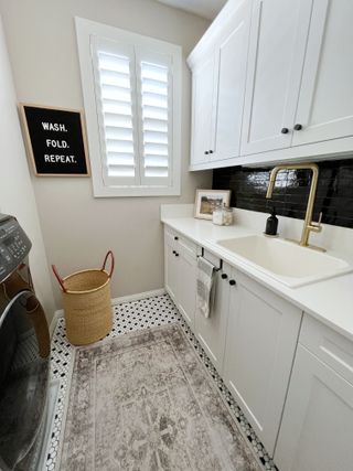 laundry room storage ideas upper and lower wall cabinets by Audrey Crisp Interiors
